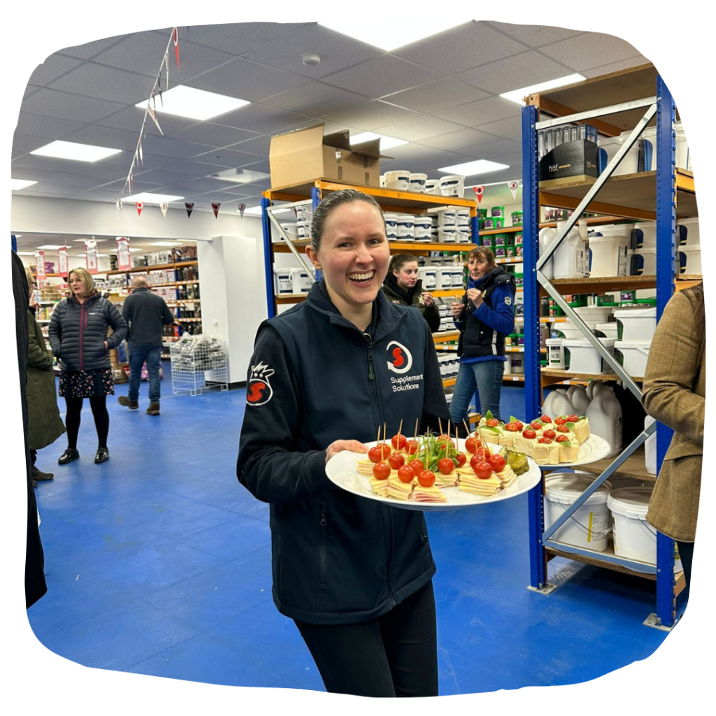 Our new shop is OPEN! - Team member Sophie dishing out the nibbles